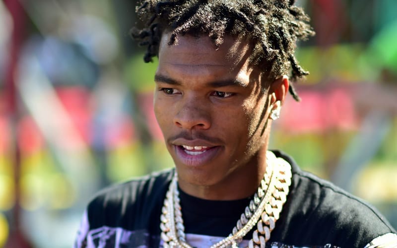 Lil Baby Donates Several Bags Of New Shoes To Neighborhood