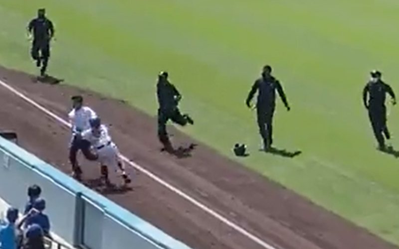 Fan Rushes LA Dodgers’ Game & Gets Taken Out By Ball Girl