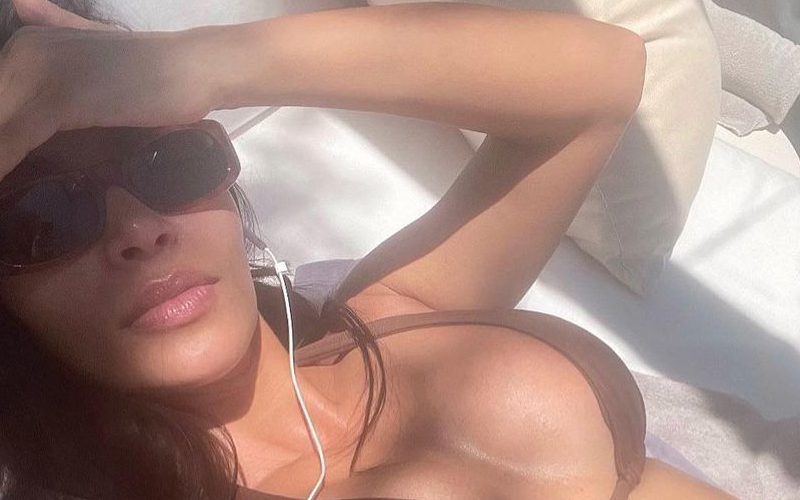 Kim Kardashian Enjoying Herself in New Bikini Sunbathing Photo