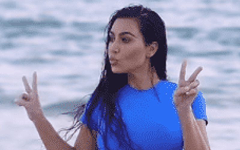 Kim Kardashian Shows Off Her Curvaceous Figure In Blue Bikini