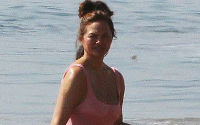 Chrissy Teigen Stuns In Swimsuit On Beach Outing After Revealing IVF Treatments