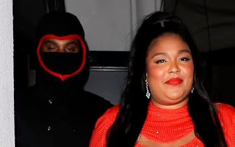 Lizzo Holds Hand With Mystery Man While Showing Off In A Red Minidress