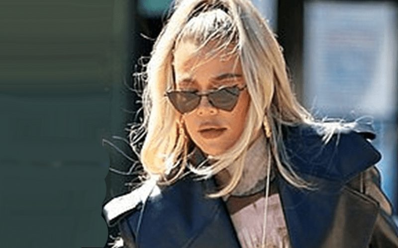 Khloe Kardashian Sports Matrix Look In Leather Trench Coat