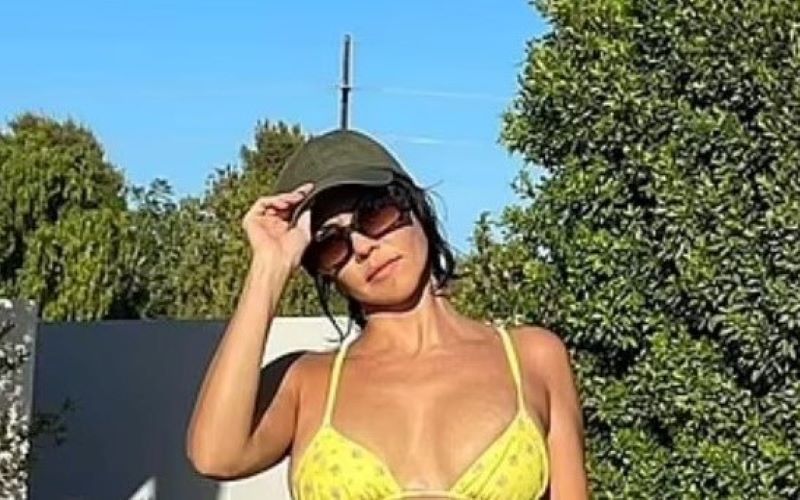 Kourtney Kardashian Flaunts Her Abs In A Yellow Bikini For POOSH