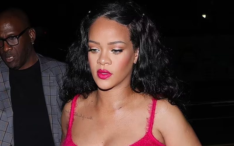 Rihanna Exposes Baby Bump In Scarlet Minidress With Faux-Fur Trim