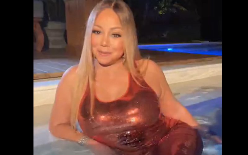 Mariah Carey Relaxes In Jacuzzi Wearing Evening Gown
