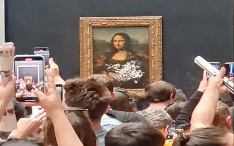 The Mona Lisa Covered In Cake In A Vandalism Stunt
