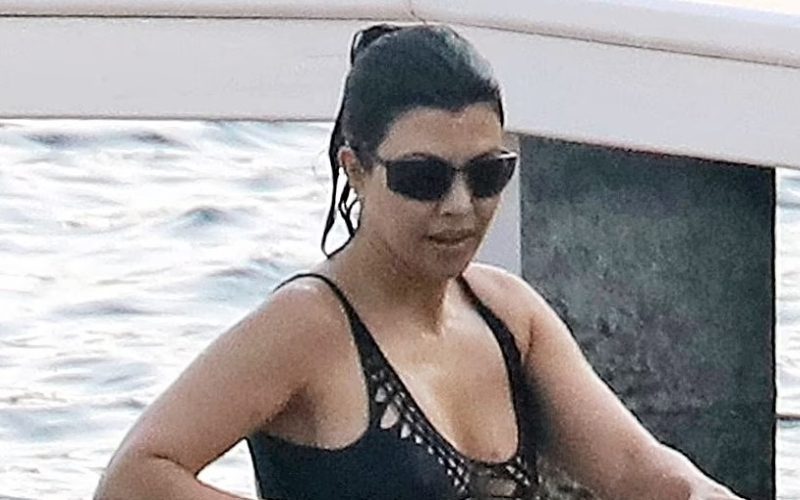 Kourtney Kardashian Pulls In Attention With Skimpy Black Swimsuit During Trip To Italy