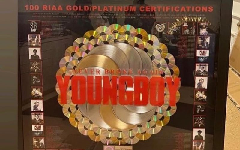 NBA YoungBoy Flexes Plaque For 100 Gold & Platinum Singles