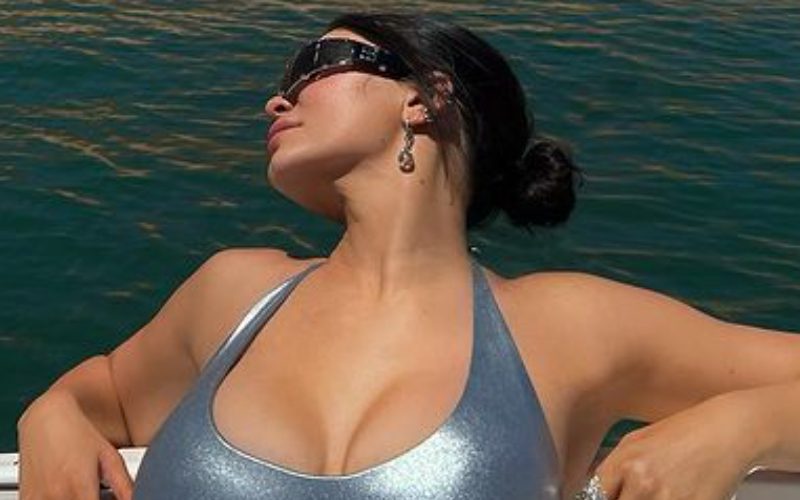 Kylie Jenner Catches Some Sun In Tight Silver One-Piece Swimsuit Photo Drop