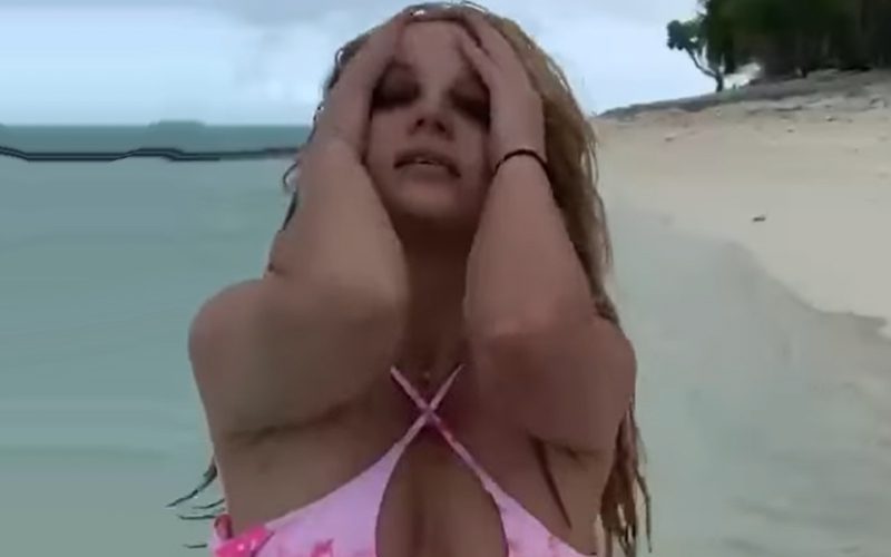 Britney Spears Enjoys Rain On The Beach In Skimpy Cutout Pink Bikini