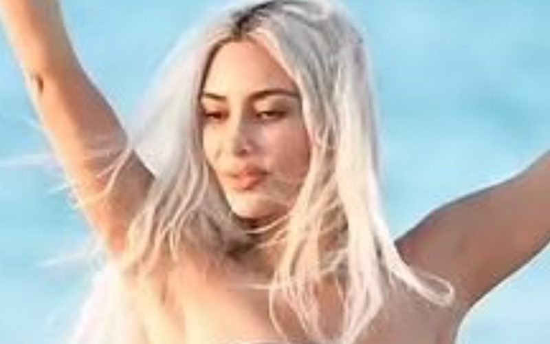 Kim Kardashian Shows Off Her Curvy Figure On Beach During Vacation