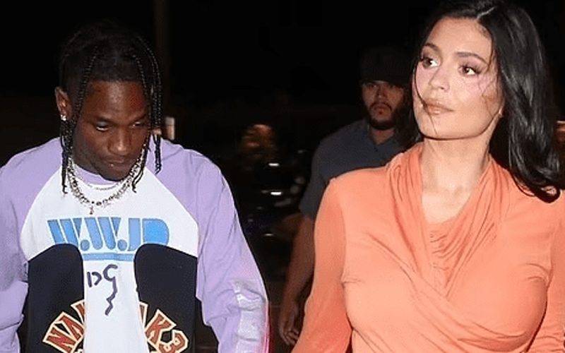 Kylie Jenner Shows Off Flawless Curves In Figure-Hugging Orange Dress While Out With Travis Scott