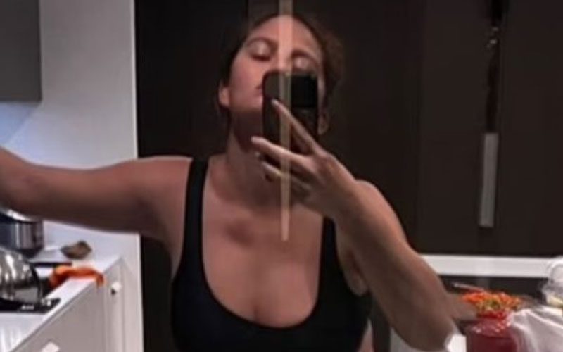 Chrissy Teigen Shows Off Her Growing Baby Bump In Skimpy Athletic Bra Photo Drop