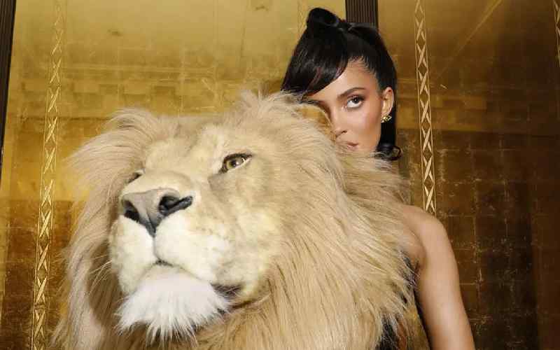 Kylie Jenner Criticized For Wearing ‘Disturbing’ Lion Head Dress At Paris Fashion Week