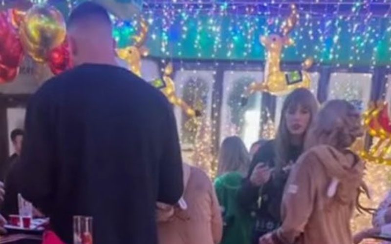 Taylor Swift and Travis Kelce’s Festive Visit to Kansas City Bar Sparks Matching Squirrel Sweater Rumors